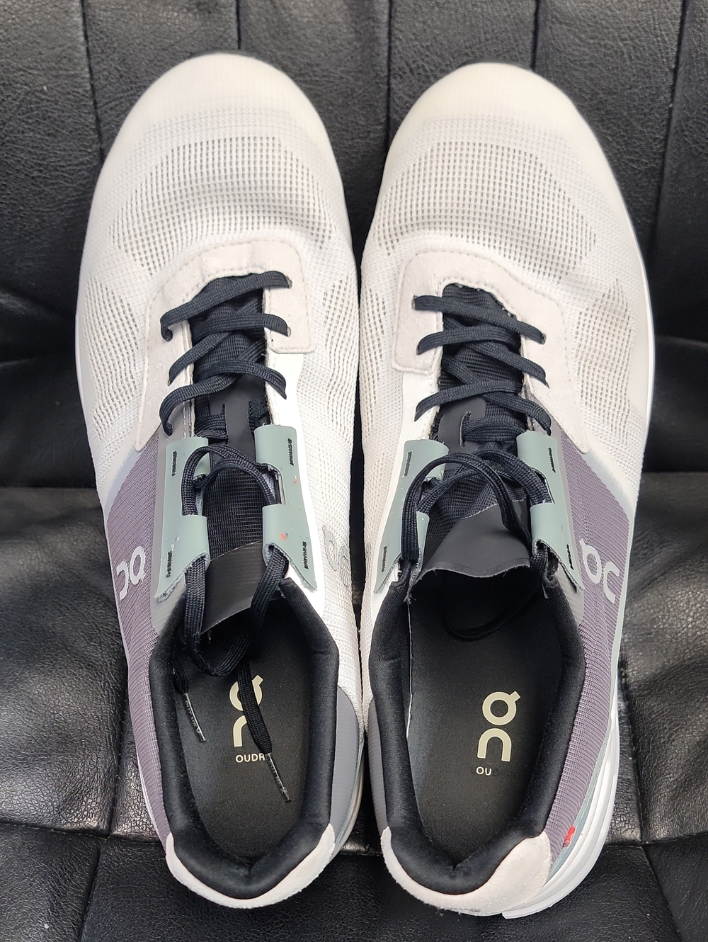 On Running Men’s Athletic Shoes in White, Black, and Purple
